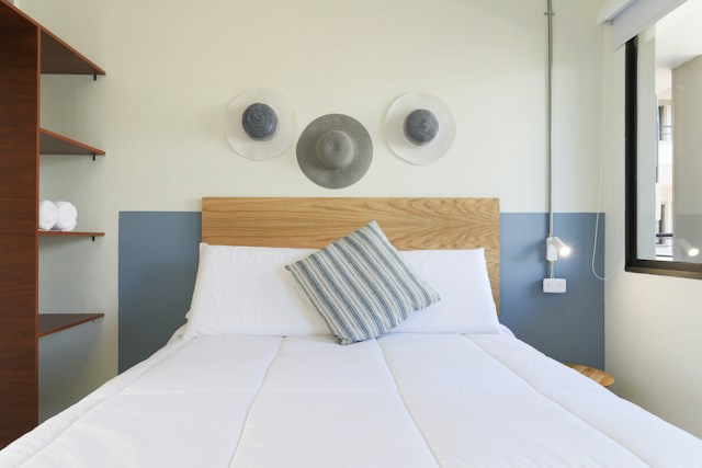 Clean mattress with white bedding